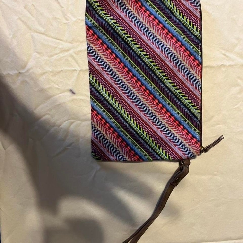 Multicolored patterned clutch bag with wrist strap